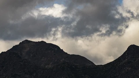 Clouds flowing over Yukon mountain range 8K time lapse Stock Footage 113995291