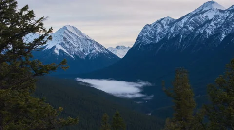 Clouds flowing through a valley in the mountains Video stock 69009089