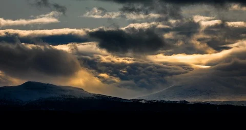 Clouds flowing like a waterfall over the mountains Stock Footage 123084558