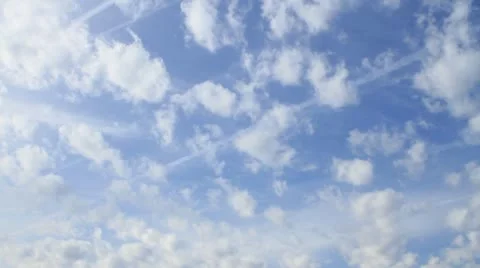 Clouds fluffy time lapse over a blue sky Stock-Footage 12679397