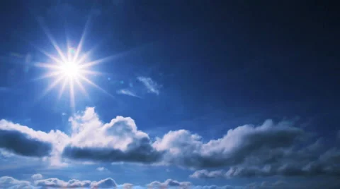 Clouds fly across the blue sunny sky Stock Footage