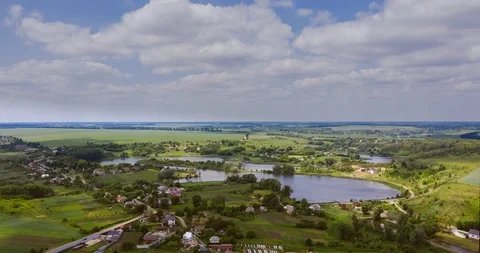 Clouds fly fast over a winding Amazing  lake and green forests on a sunny summer Stock-Footage 112702866