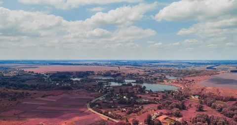 Clouds fly fast over a winding Amazing  lake and green forests on a sunny summer Stock Footage 112706622