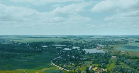 Clouds fly fast over a winding Amazing  lake and green forests on a sunny summer Stock Footage 112718715