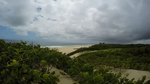 Clouds fly over the beach of the Indian Ocean in the daytime. Timelaps Stock Footage 71407492