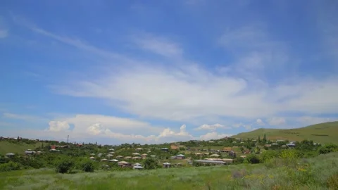 Clouds fly over a Caucasian village Stock Footage
