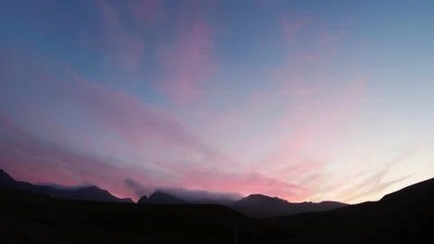 Clouds fly over the mountain range at sunset Stock-Footage 88451114