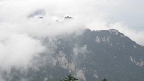 Clouds fly over the mountains Stock Footage 76945416