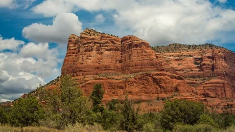 Clouds fly over red rock formations in this time-lapse taken in Sedona, AZ. Video stock 80826471