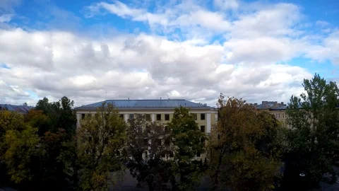 Clouds fly over the roofs of houses. Stock Footage 95693760