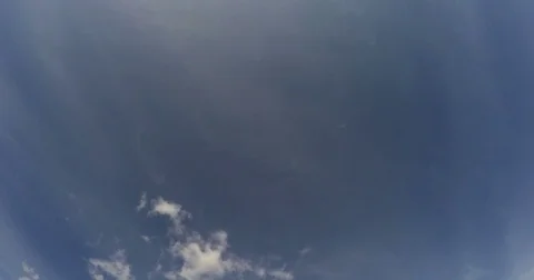 Clouds fly through the blue sky Stock Footage 79384488