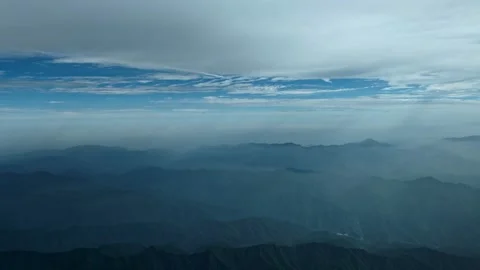 Clouds flying above the mountains on a misty morning Stock Footage 280094333
