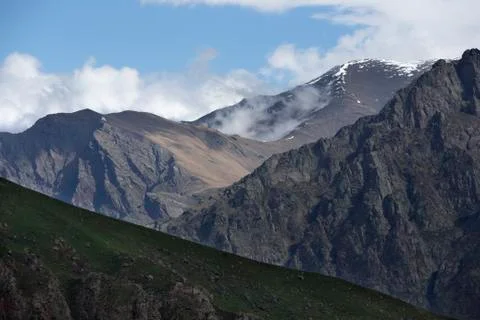 Clouds Flying Between Mountains Stock Photos