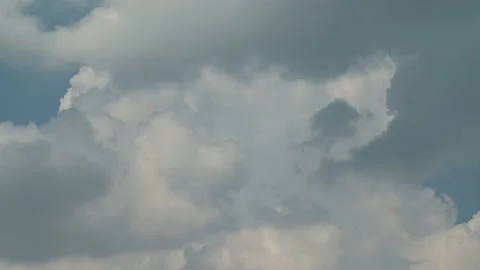 Clouds flying in the blue sky on a summer day. Timelapse. Stock Footage 214053196