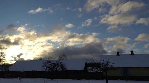 Clouds flying over the roofs of village houses Stock Footage 83521481