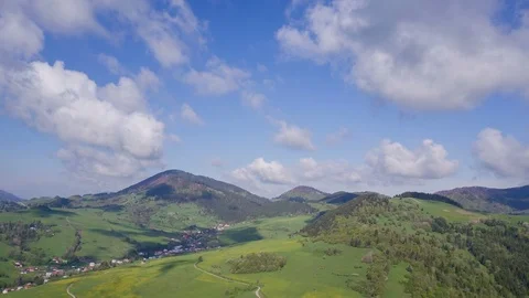 Clouds flying over spring landscape and blue sky. Time Hyper Lapse Stock Footage 86014812