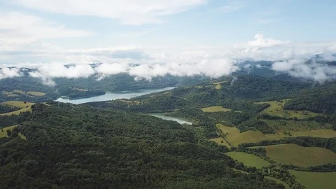 Clouds of fog after summer rain. landscape with lake and mountain woodland Stock Footage 125846265