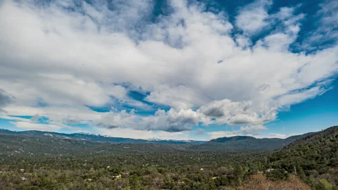 Clouds Form and Reform over Mountain Valley Stock Footage 282986625