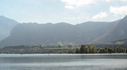 Clouds form around a snow covered mountain Stock Footage 33786460