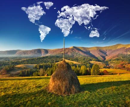 Clouds in the form of a map of the world over the mountains Stock Photos