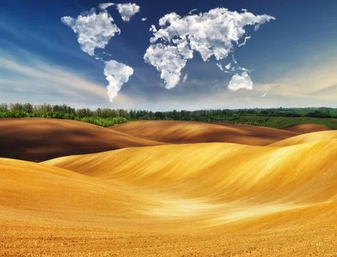 Clouds in the form of a map of the world over the field Stock Photos