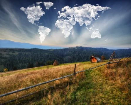 Clouds in the form of a map of the world over the mountains 写真素材