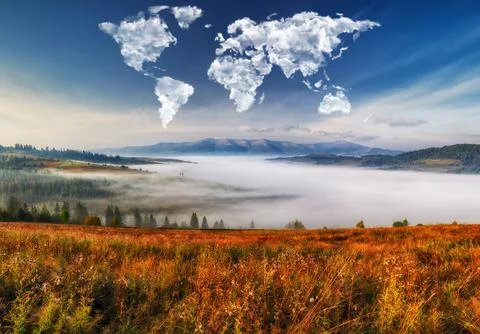Clouds in the form of a map of the world over the mountains Stock Photos