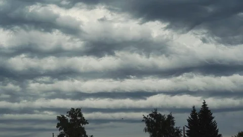 Clouds in the form of waves in the autumn sky Stock Footage 123434463