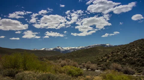 Clouds Formation above Snow Mountains by the River Stock Footage 24973505