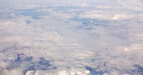 Clouds formations view from the perspective of an airplane window Stock Photos