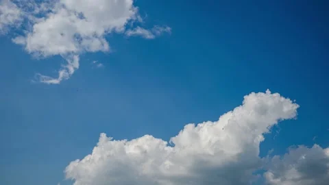 Clouds forming on blue sky time lapse Stock Footage 245542214