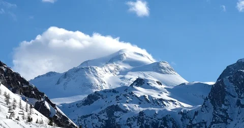 Clouds forming over ski resort snowy mountop timelapse Stock Footage 96082134