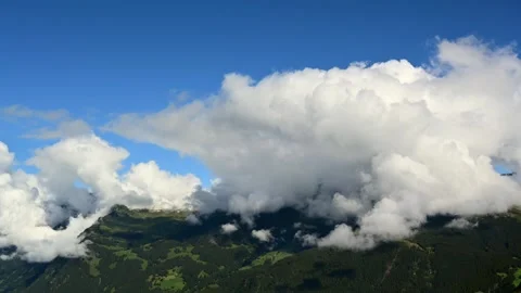 Clouds forming over Swiss mountain Stock Footage 289906424