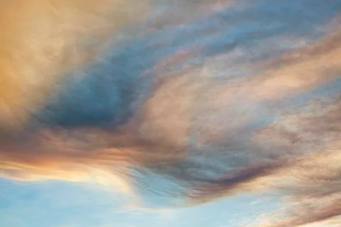 Clouds forming swirling pattern in dramatic sky Foto stock