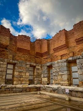 Clouds Frame Layered Terracotta Bricks Over Stone Niches Stock Photos