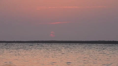Clouds Framing Red Sunset Stock Footage 305957302