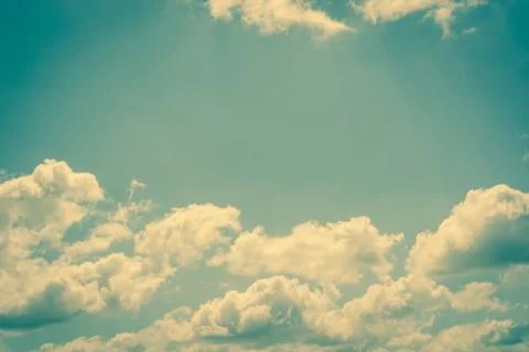 Clouds on a fresh blue sky Stock Photos