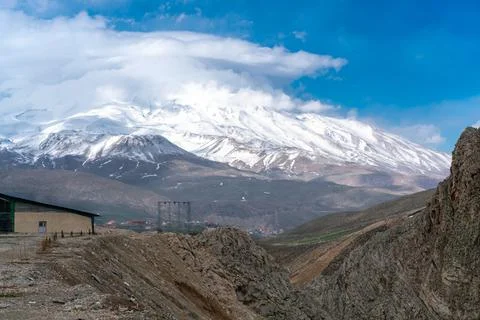 Clouds gather near the summit of Mt. Damavand, the highest stratovolcano in Asia Stock Photos