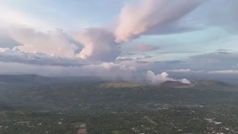 Clouds gather over volcano landscape in picturesque setting Video stock 317578601