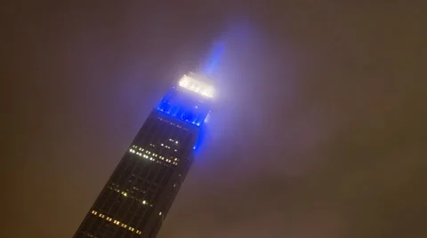 Clouds glow Around Empire State Building New York Timelapse Video stock 60699886