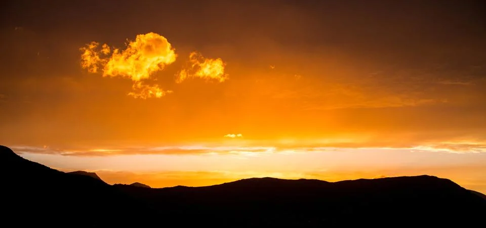 Clouds glowing in the setting sun Stock Photos
