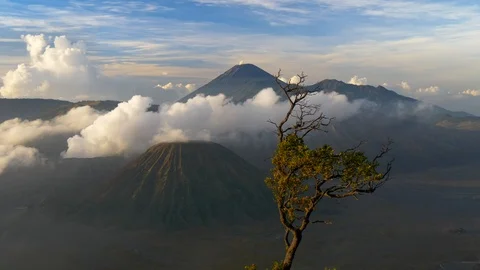 Clouds go by the Bromo volcano in East Java, Indonesia during a bright sunny day 스톡 동영상 107413699