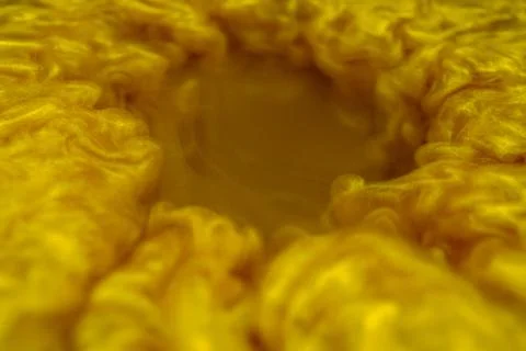 Clouds of golden dust making a vortex 02 Foto stock