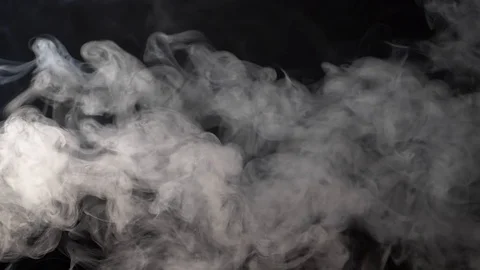 Clouds of gray smoke floating in the air on a black background. Slow motion shot 스톡 동영상 103429747
