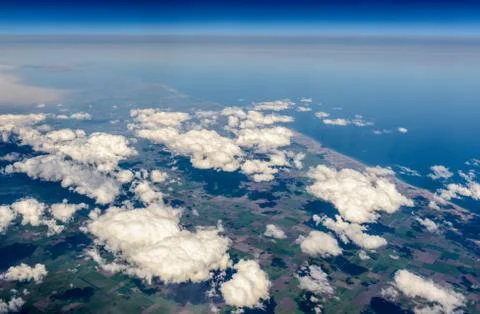 Clouds, ground, flight, ocean Stock Photos