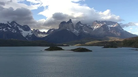 Clouds hanging over dramatic snowy mountain massif Stock Footage 82128402