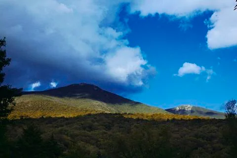 Clouds Hanging Over the Mountain Stock Photos