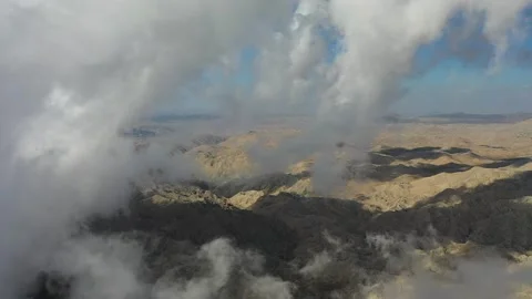 Clouds high in the mountains Aerial view Stock Footage 221203271