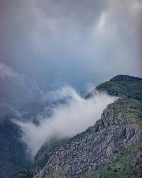 Clouds hitting between the mountain beautiful landscape Stock Photos