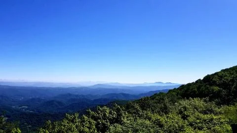 Clouds on Horizon Bordering High Mountain Vista 2 Stock Photos